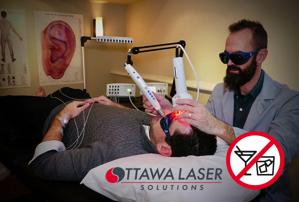 Client receiving laser therapy to quit alcohol.